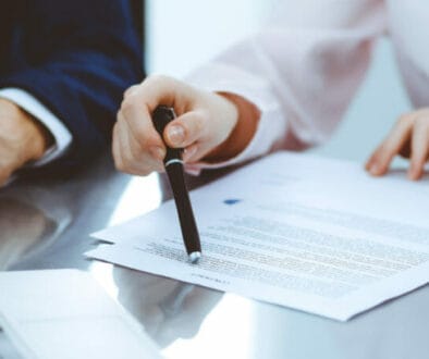 1200 business law attorney pen pointing contract