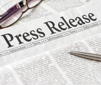 A newspaper with the headline Press Release